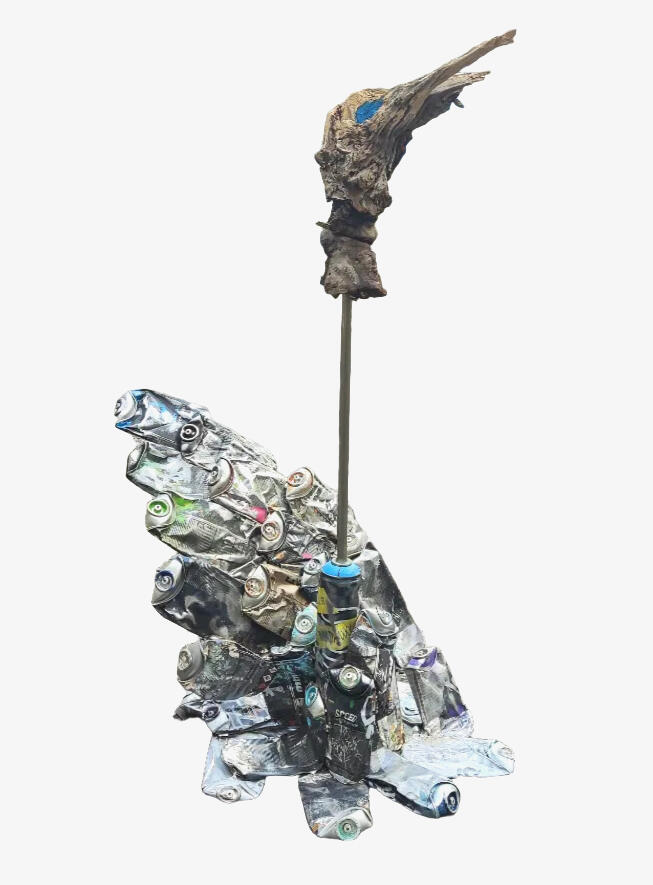 Spraycan sculpture of a fragmented phoenix bird made from used spray cans, contemporary urban art